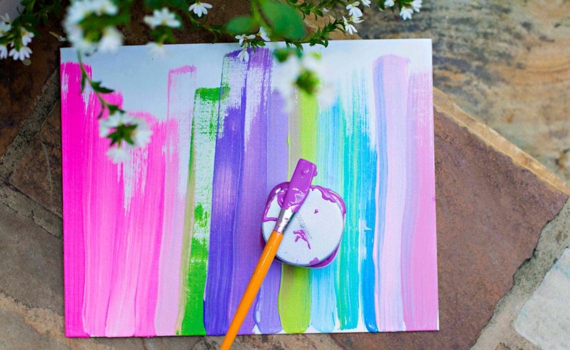 closeup shot of a colorful paper and paint brush